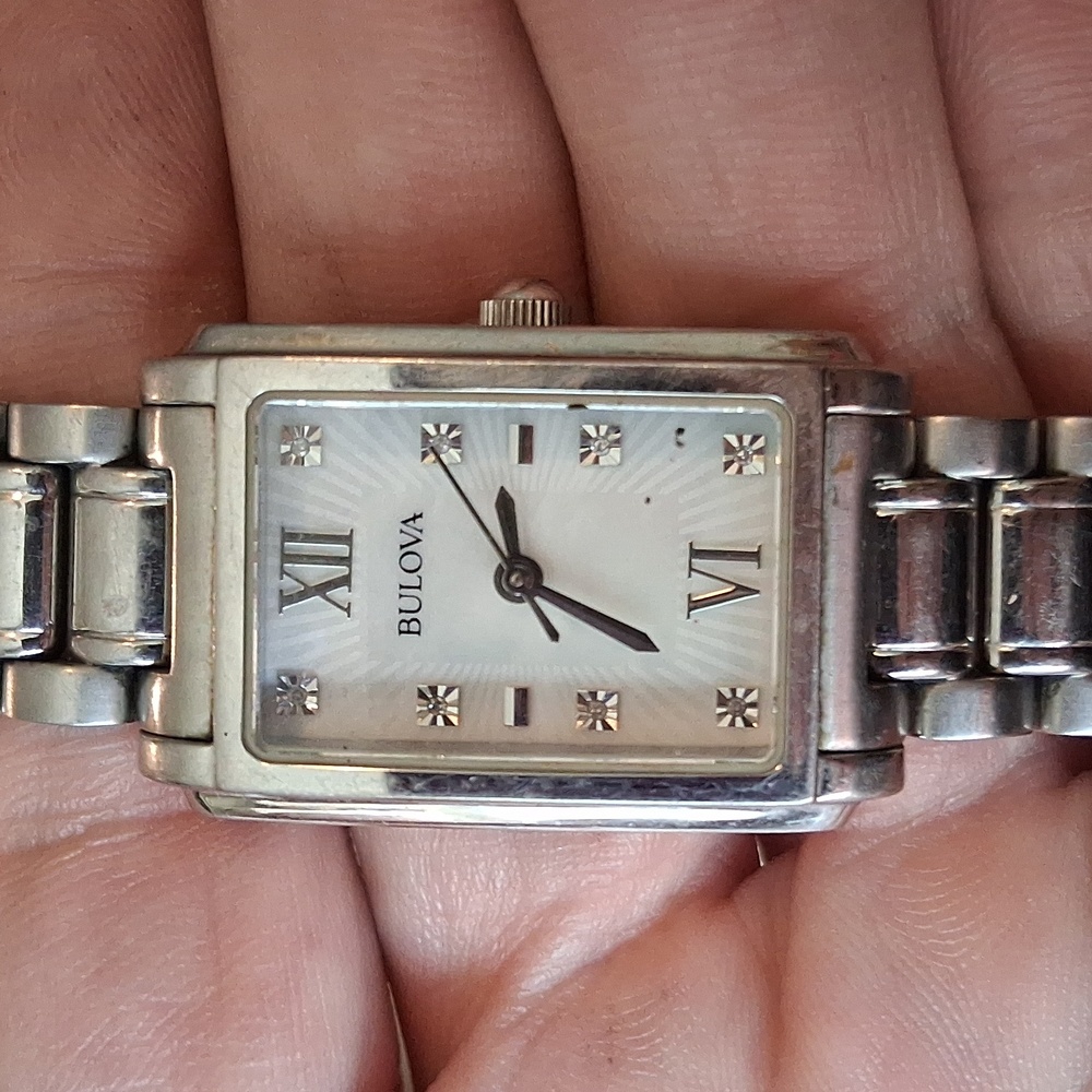 Bulova square face mother of pearl silver band
